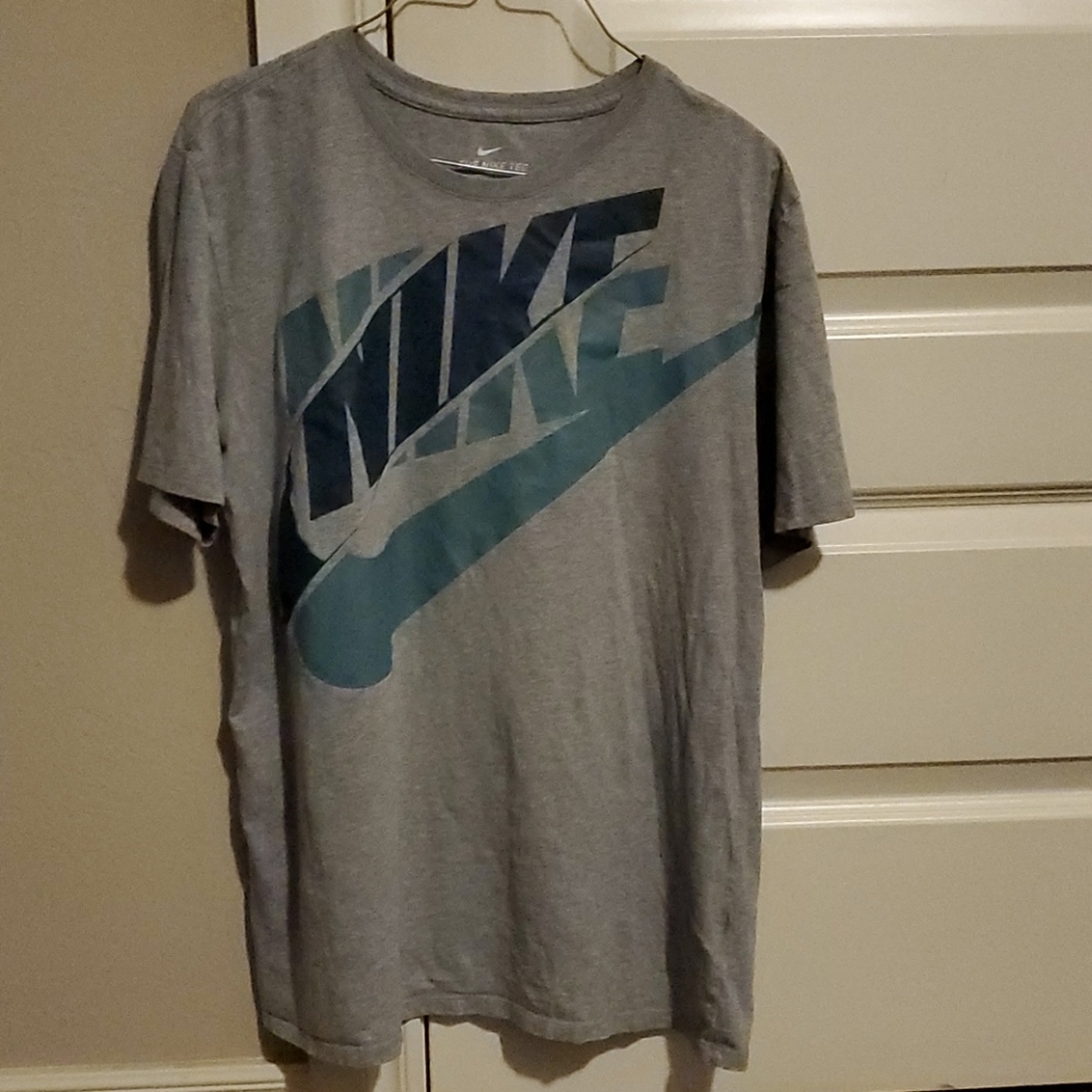 Nike gray t shirt with blue letters.